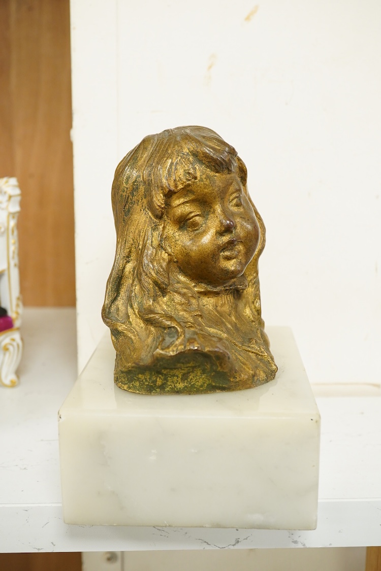 A late 19th century gilt bronze bust of a girl, indistinctly signed, raised on marble base, 16cm high